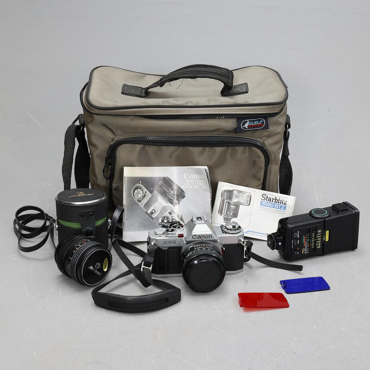 CAMERA, Canon AV-1 with flash and lens and case.