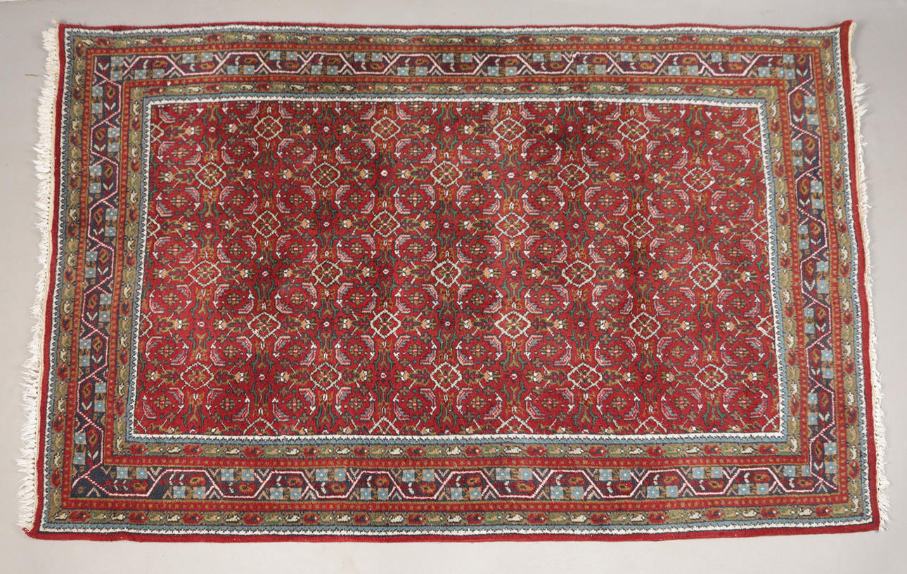 A PERSIAN RUG.