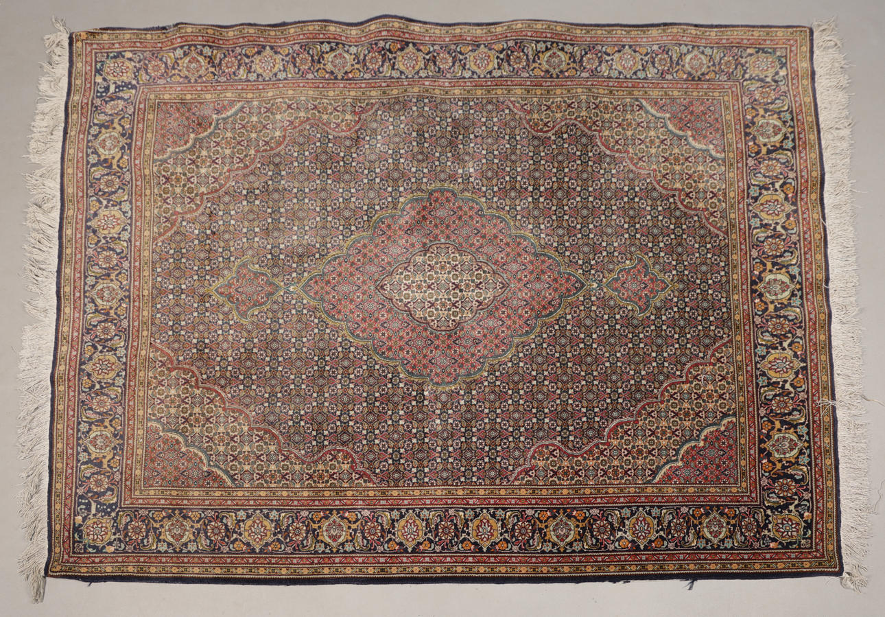 A TABRIZ RUG.