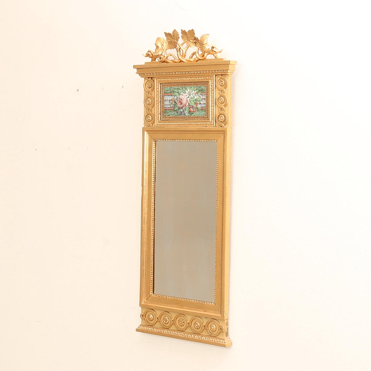 A gilded and bronzed mirror, 19th century.