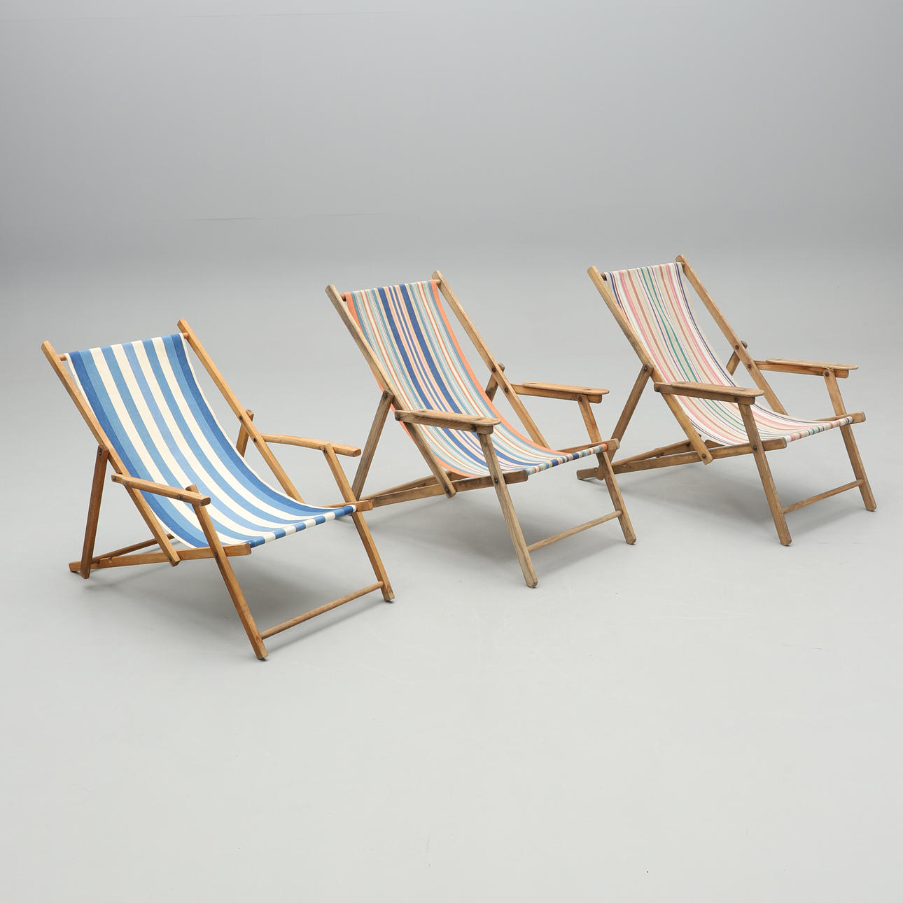 Three folding sun loungers, 20th century.