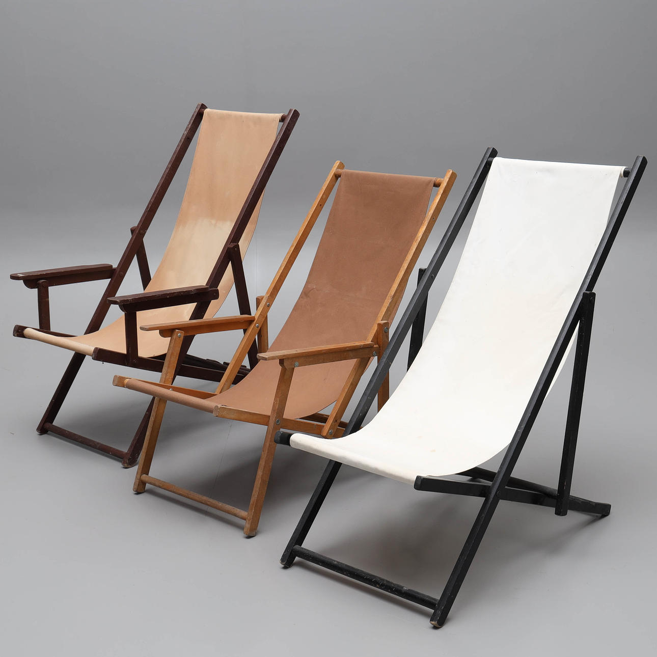 Three 20th century sun loungers.