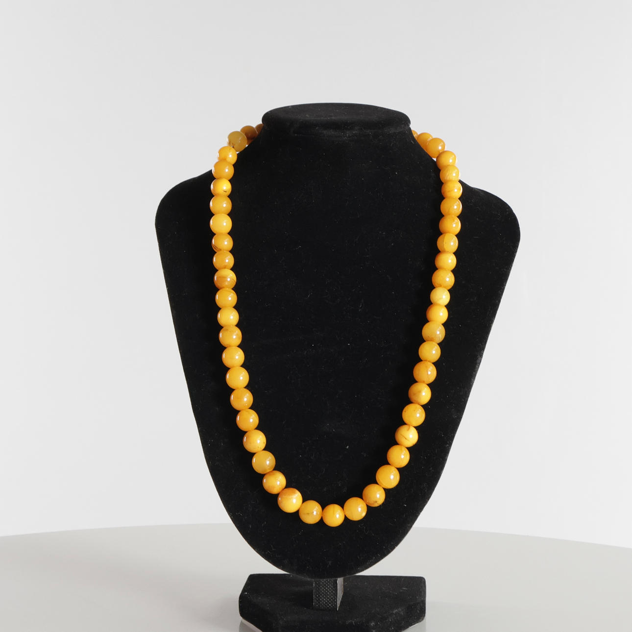 Necklace with round amber beads.