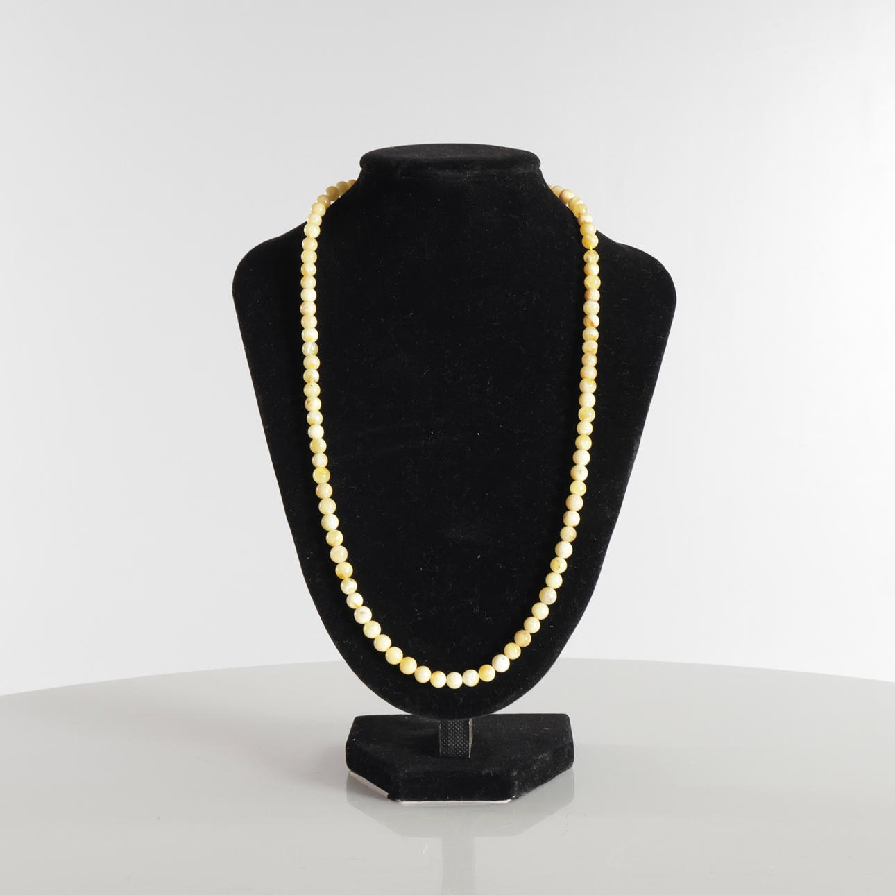 Necklace with round amber beads.