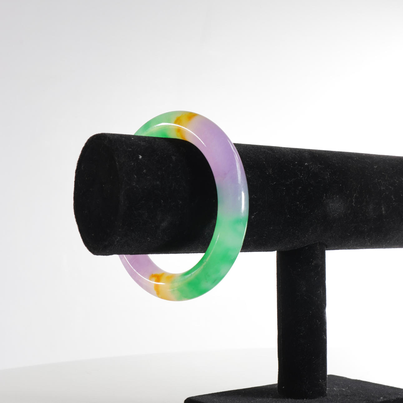 Bangle of multicolored jade.