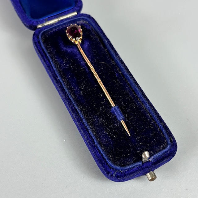 ANTIQUE STONE SET STICK PIN.