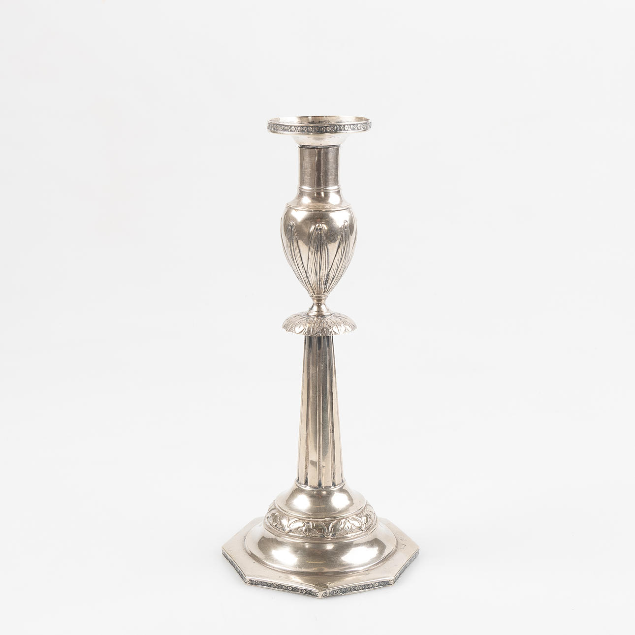 A silver candlestick, approx. 1800.