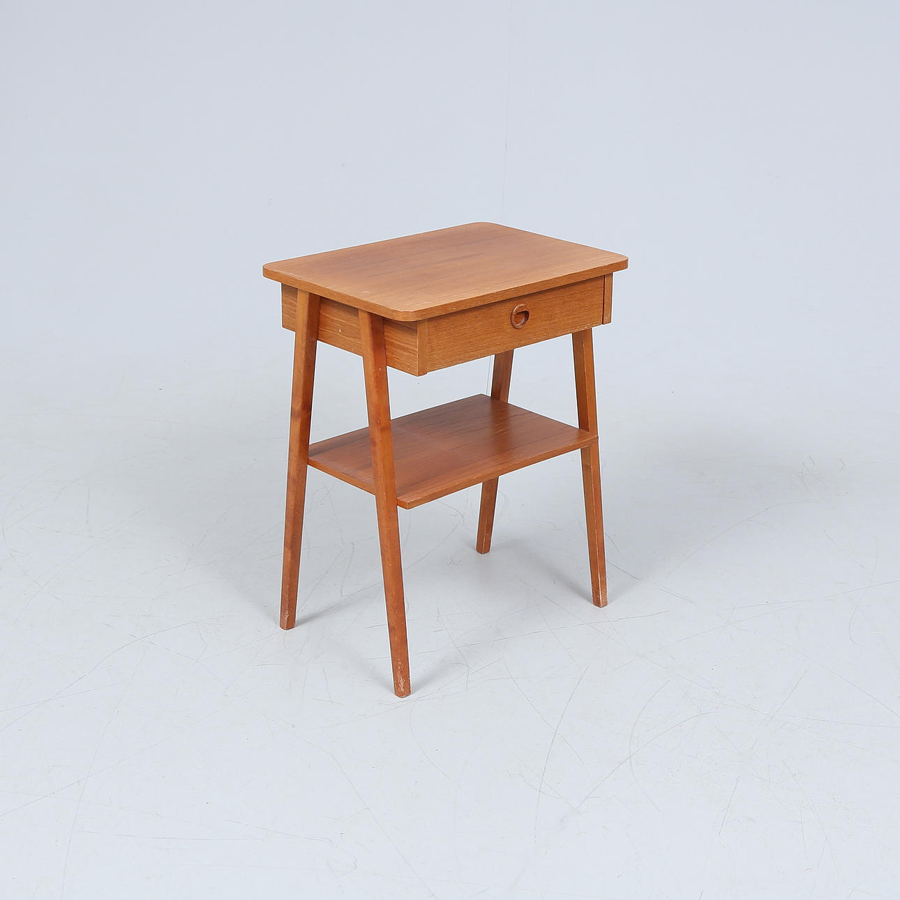 A 1960's teak veneer bedside table.