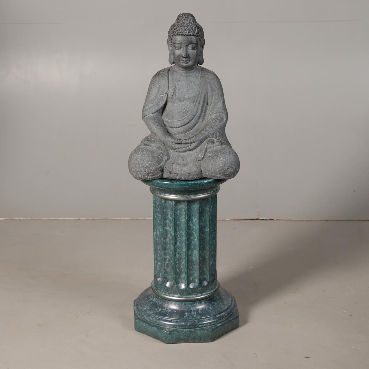 A BUDDHA ON AN ASSOCIATED PLINTH.