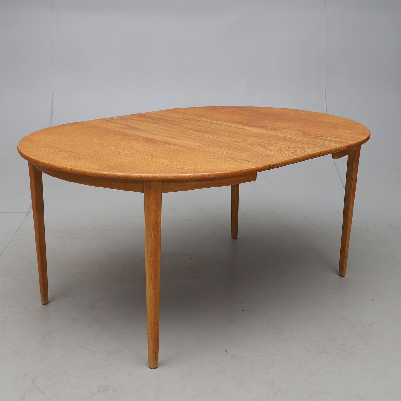 A teak dining table, 1950s/60s.