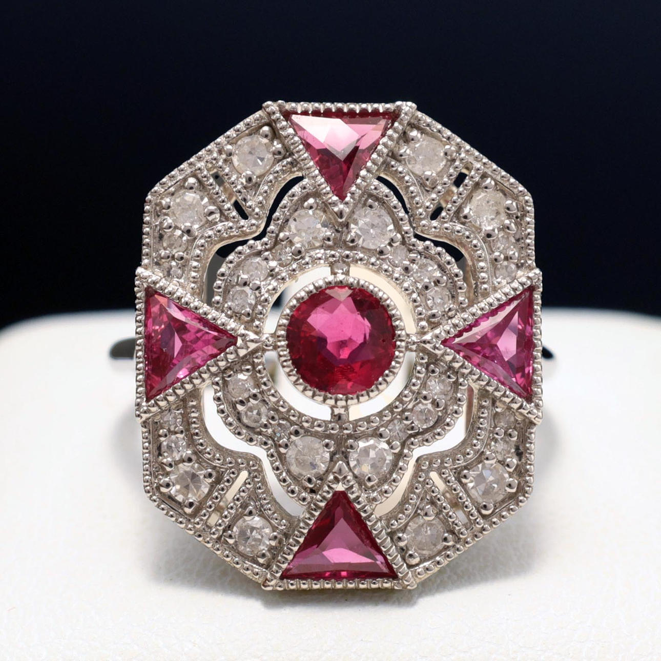 A PLATINUM OCTAGONAL PANEL RUBY AND DIAMOND RING. Jewellery & Gemstones ...