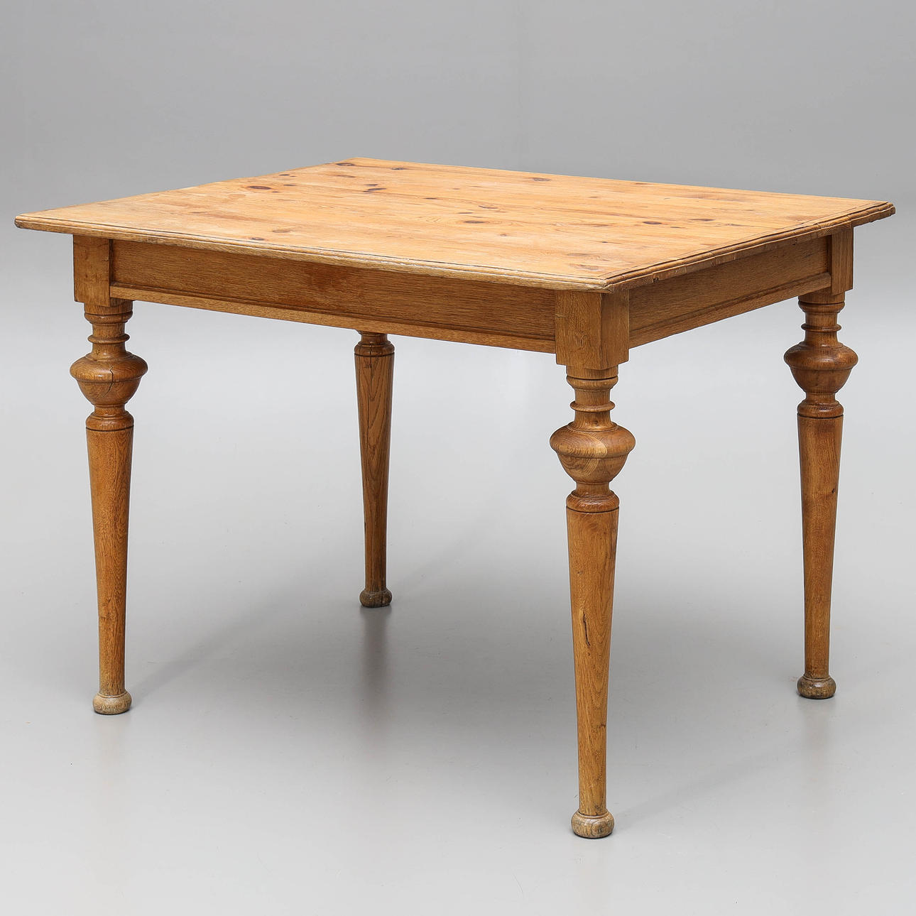 A 20th century pine table.
