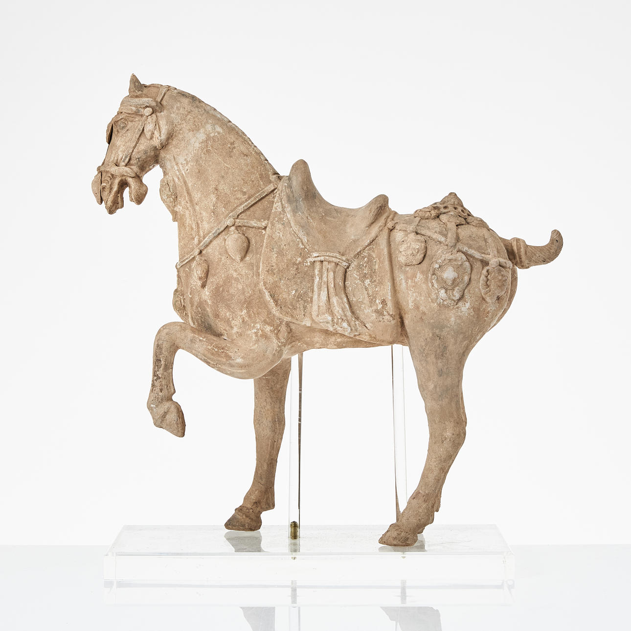 A Chinese earthenware sculpture, 20th century, in the shape of a horse ...
