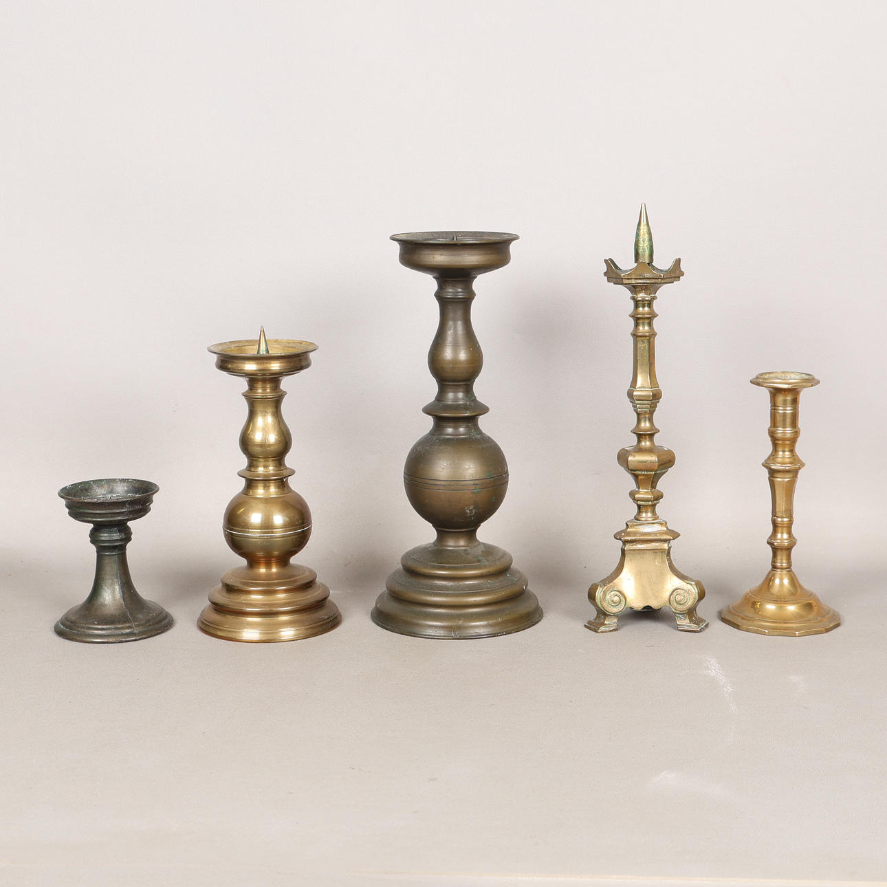 A SELECTION OF PRICKET CANDLESTICKS (5).