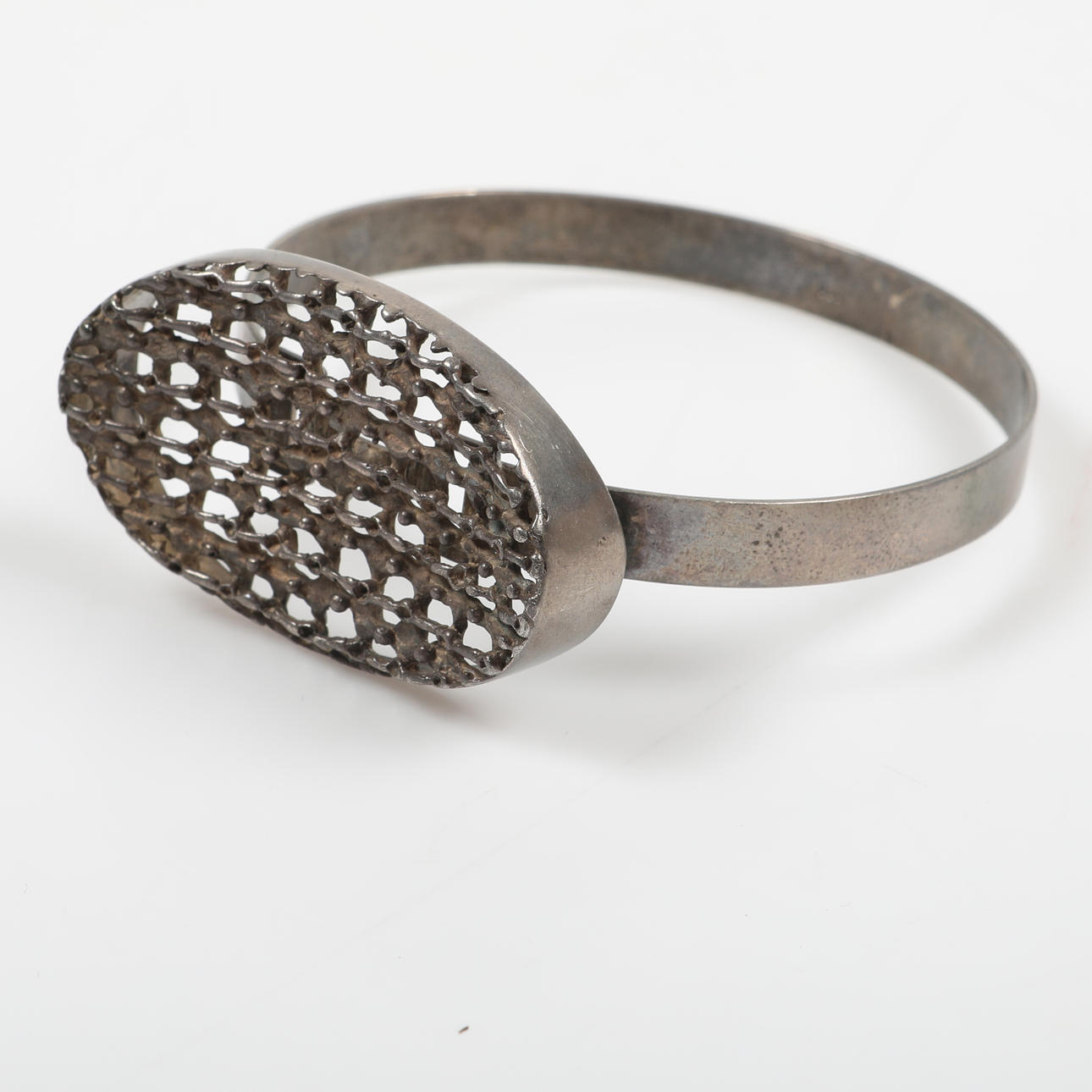 BRACELET, silver with braided silver thread.