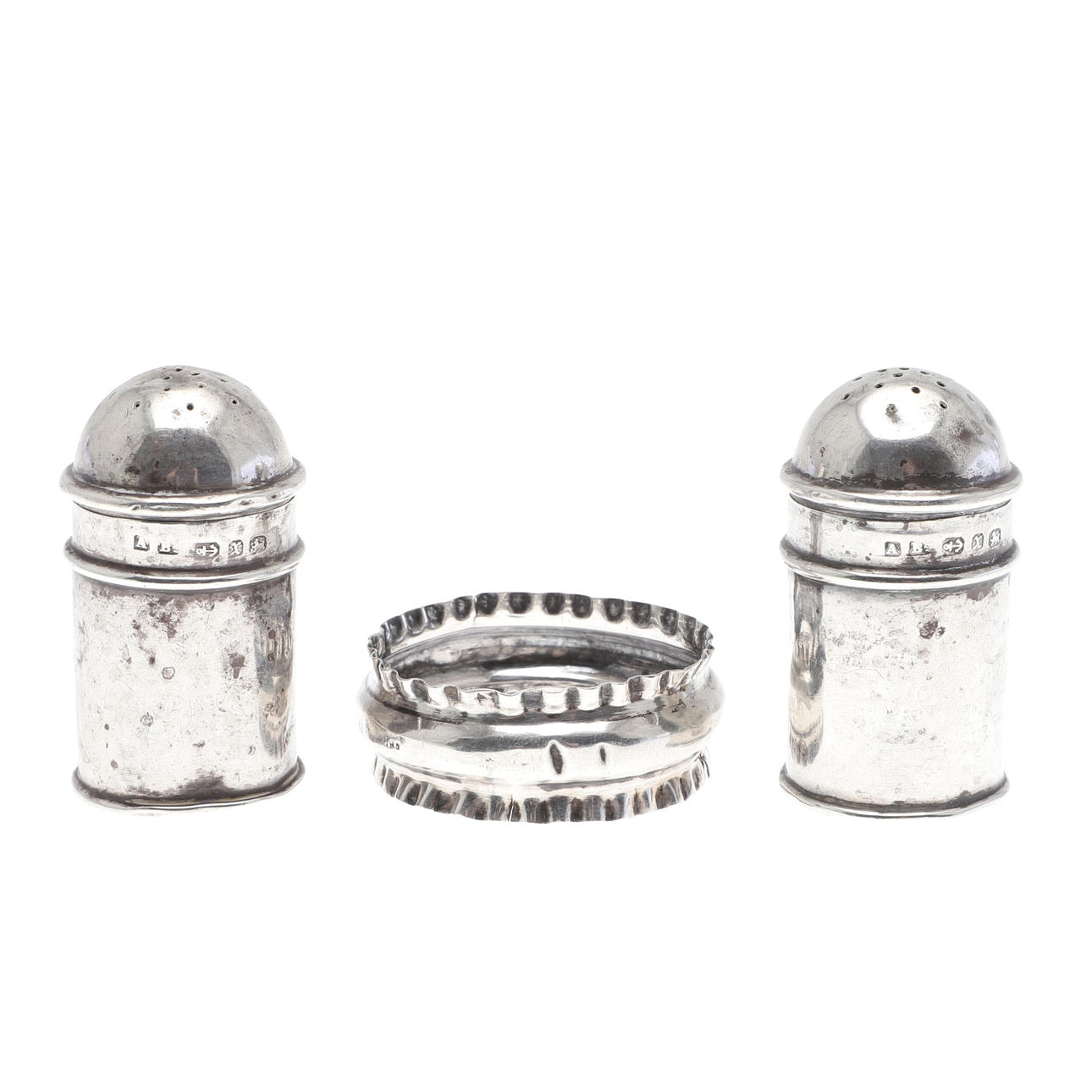 TWO SILVER PEPPER POTS AND A NAPKIN RING.