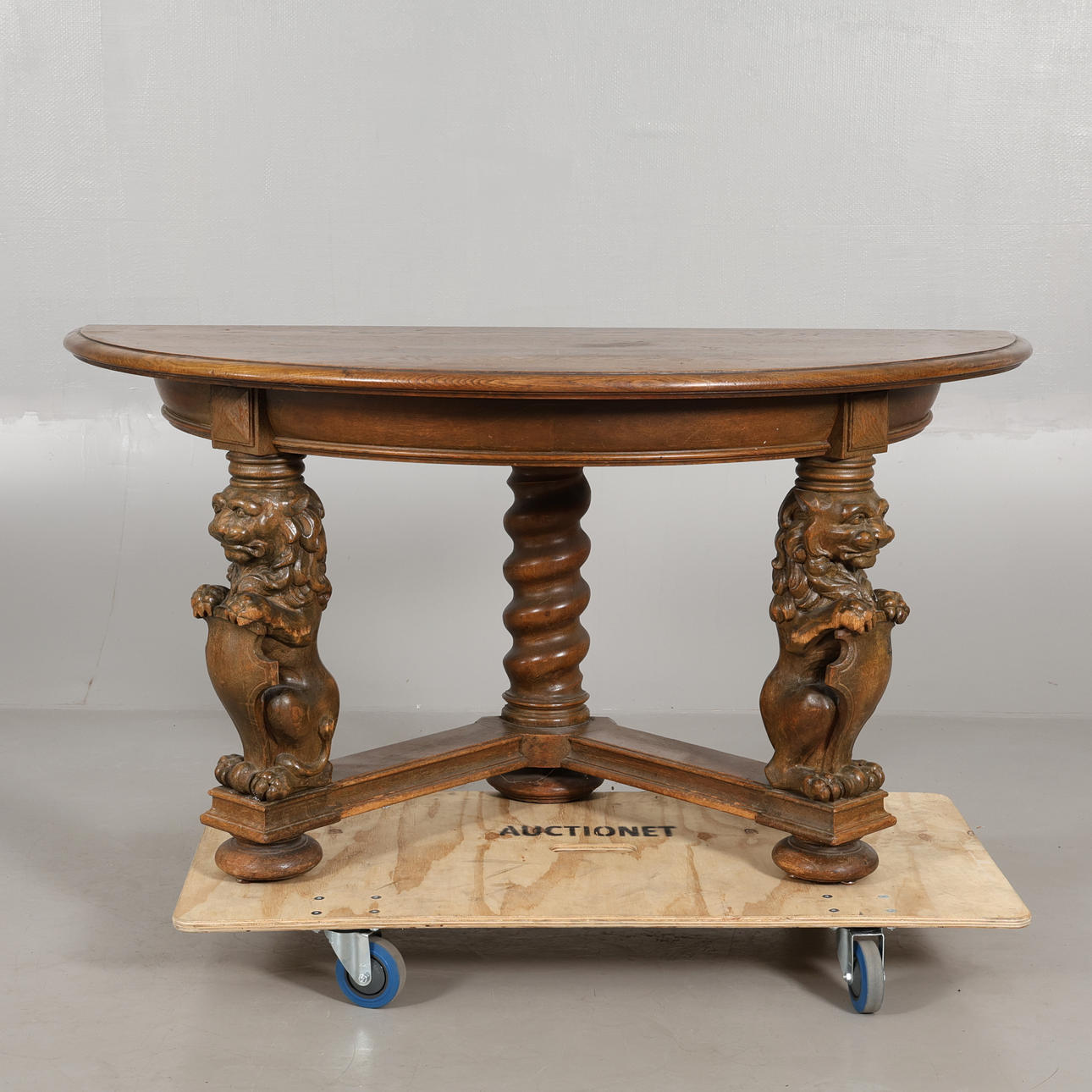 An oak half-moon table, 20th century.