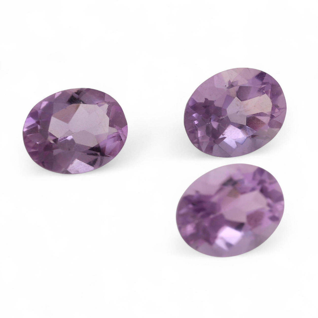 Three unmounted amethysts.