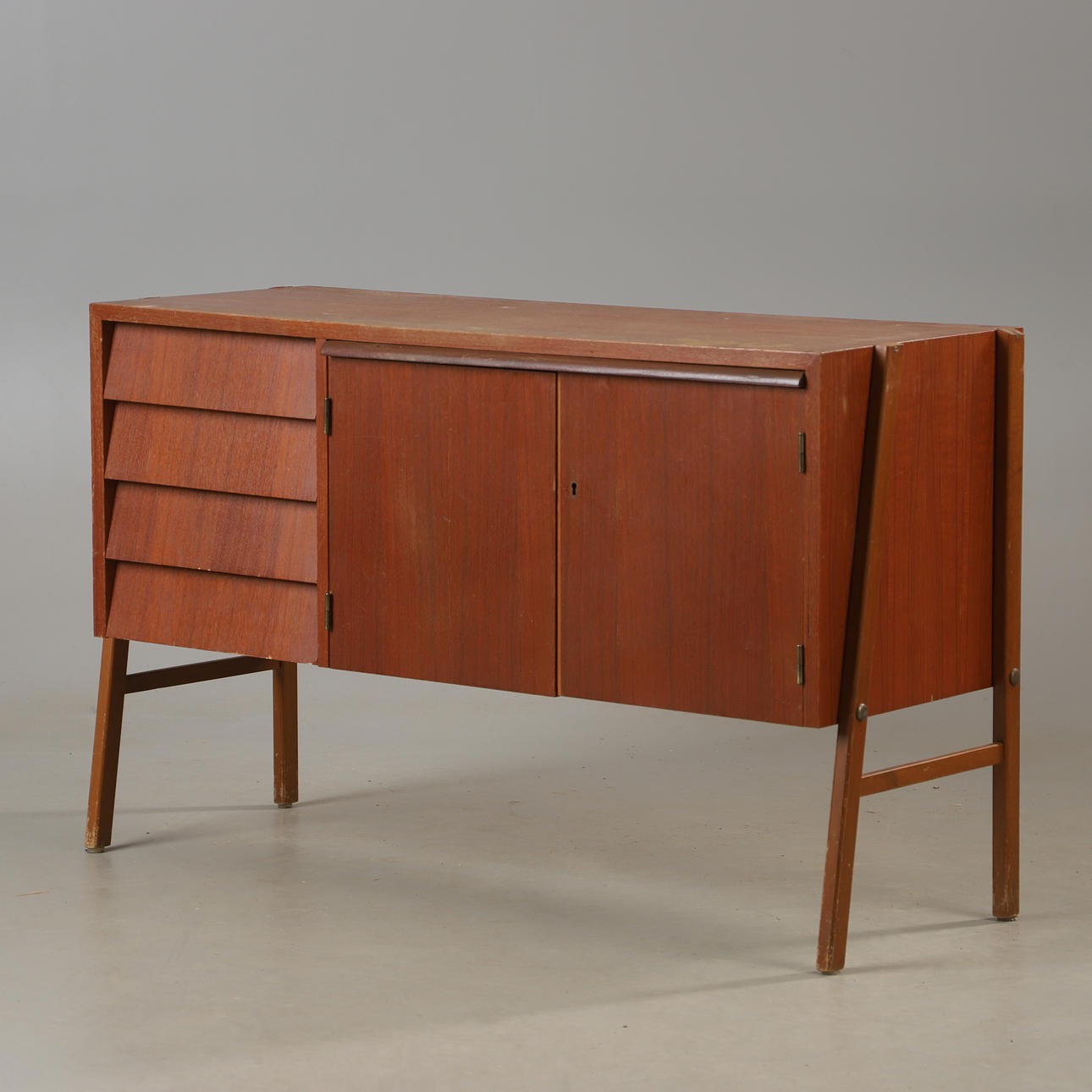 A mid 20th century teak and beech sideboard.