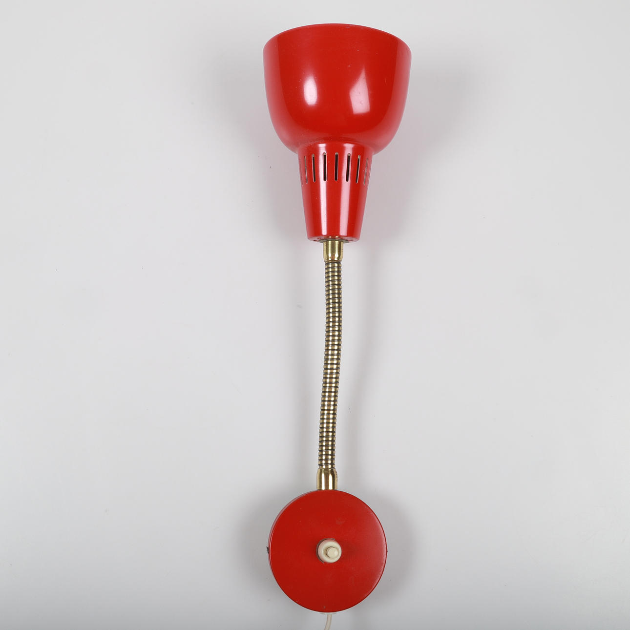 A wall lamp, red lacquered sheet, 20th century.