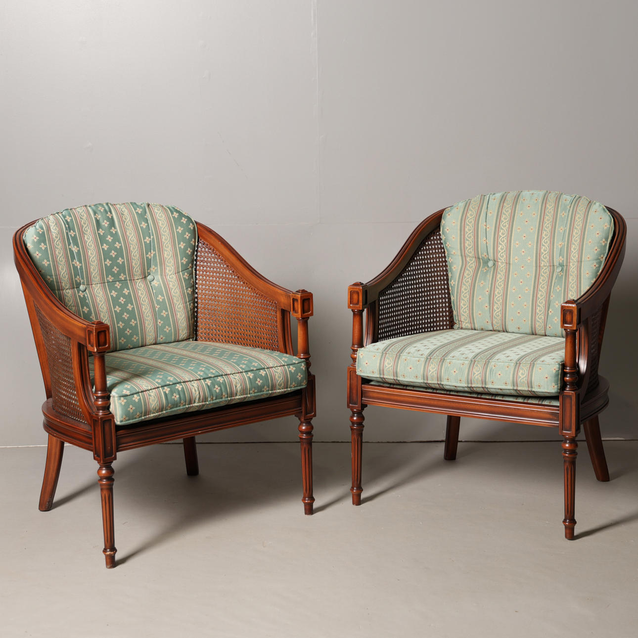 A PAIR OF CANE ARMCHAIRS (2).