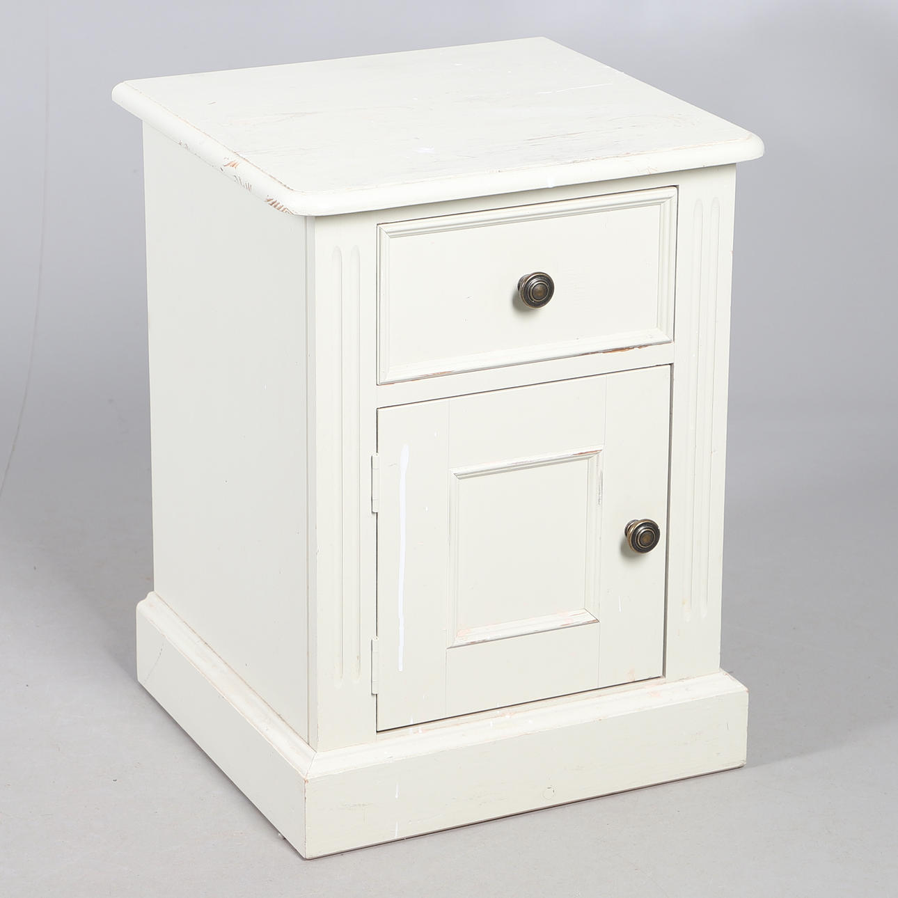 A PAINTED BEDSIDE CUPBOARD.