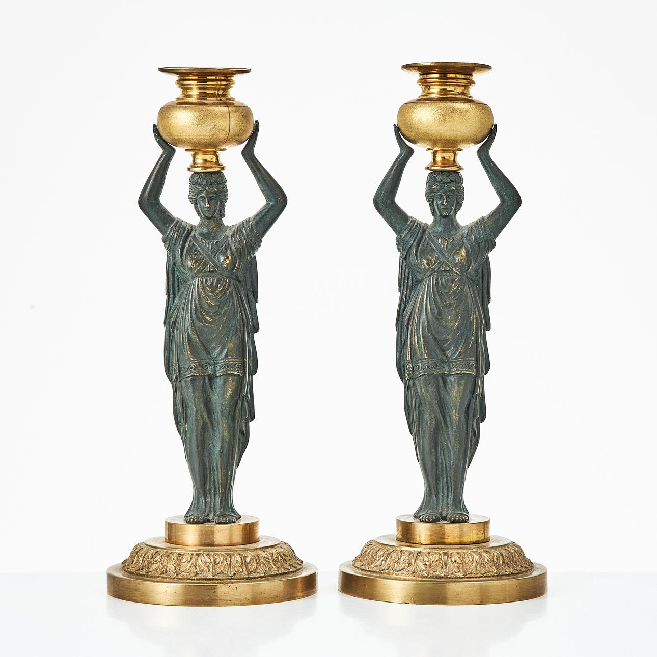 A pair of empirical candlesticks, circa 1900.