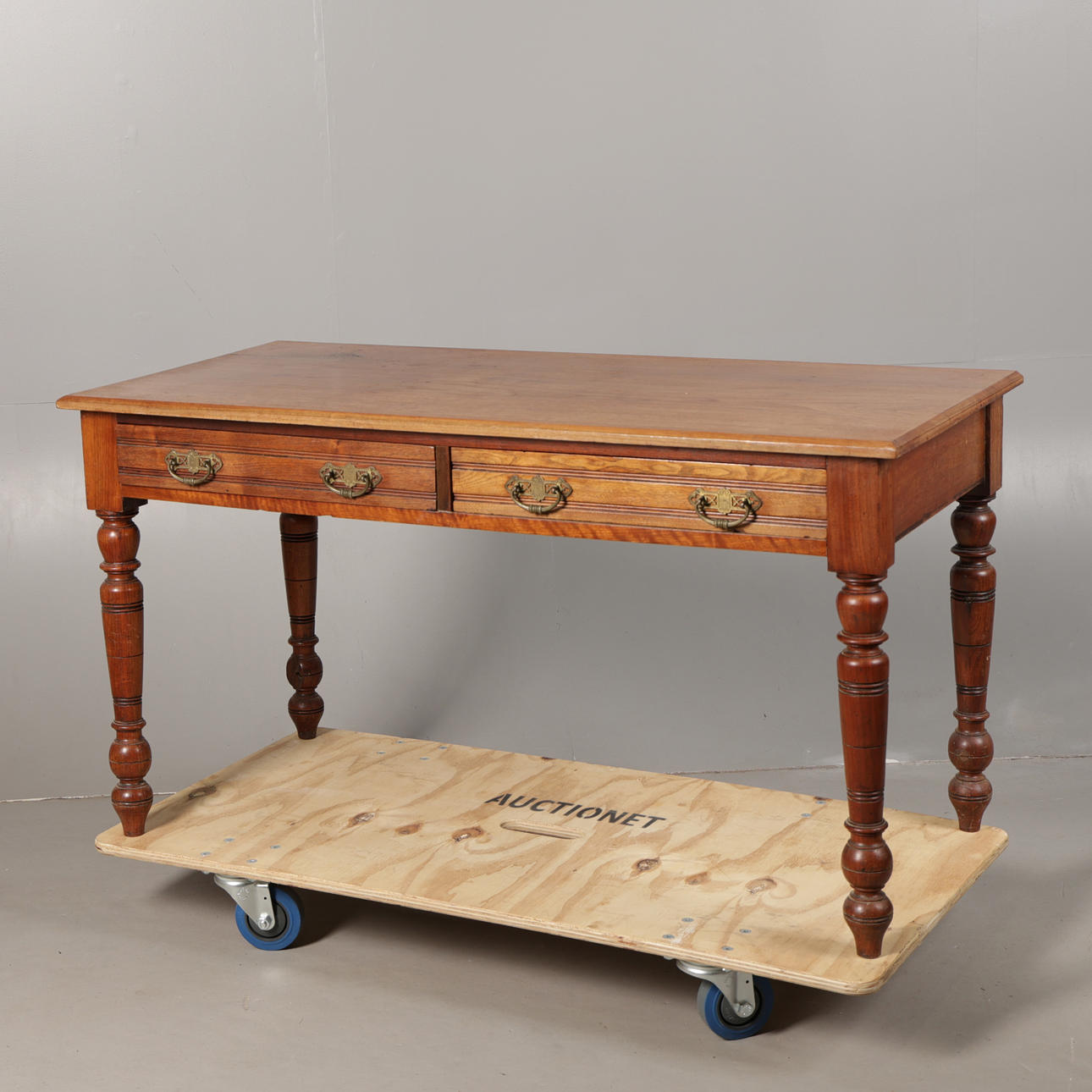 A LATE VICTORIAN WALNUT TWO-DRAWER SIDE TABLE.