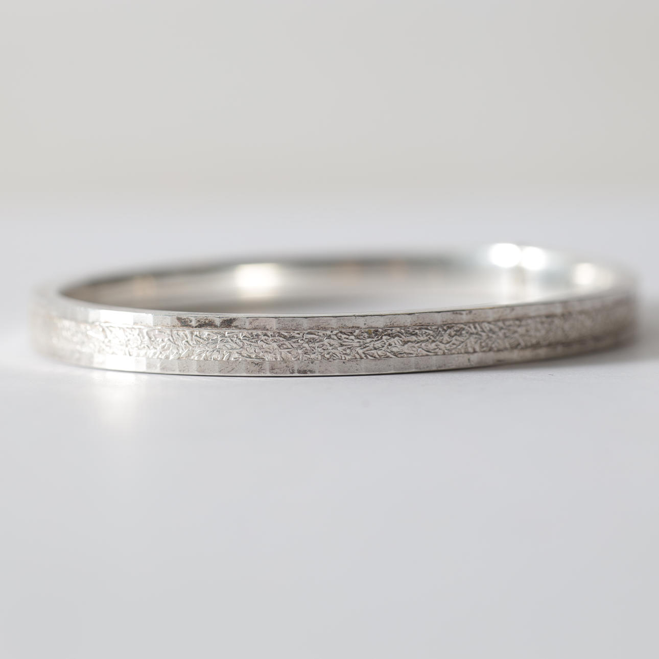 A silver bangle. Total weight approx. 11.9 grams.
