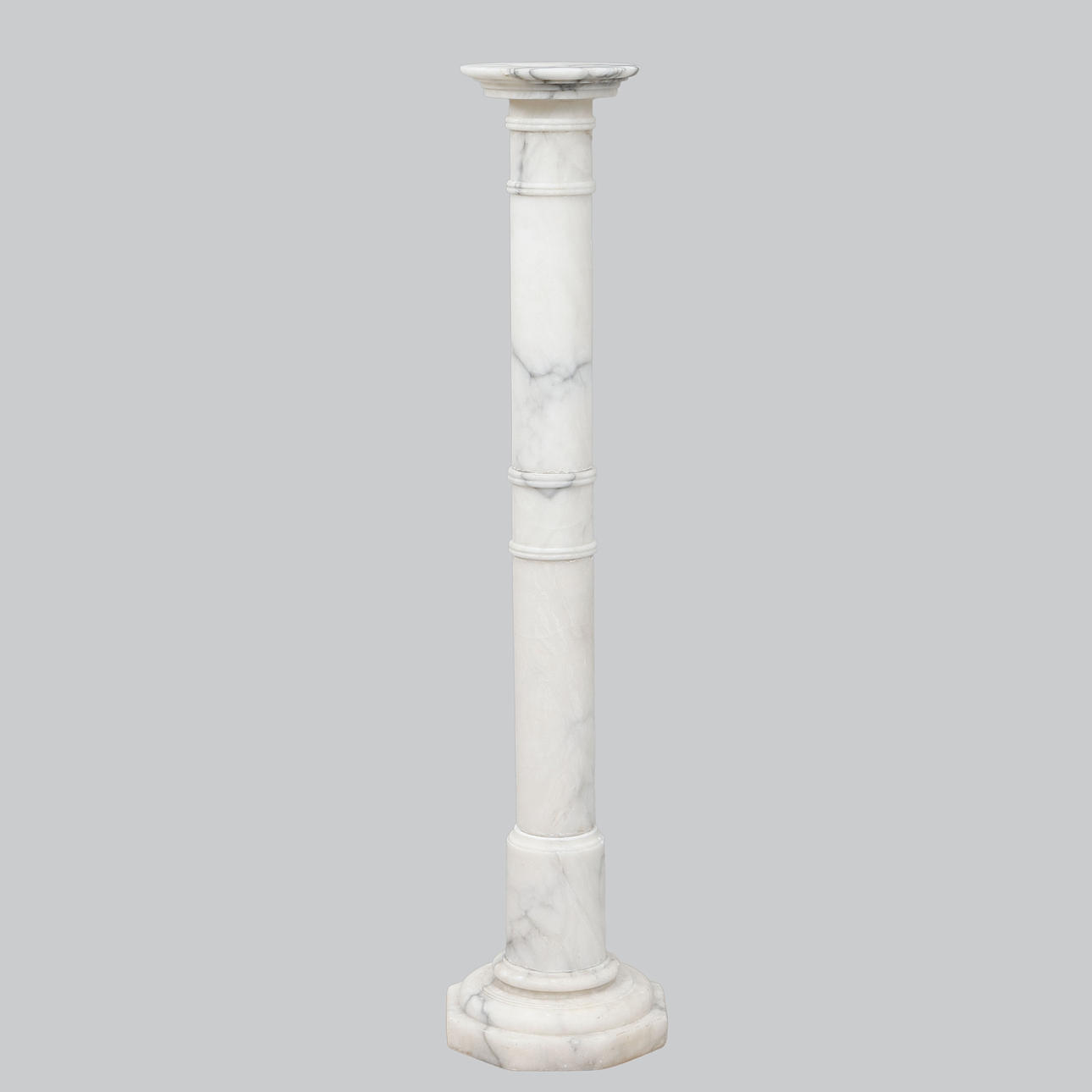 A pedestal, white marble, 20th century.