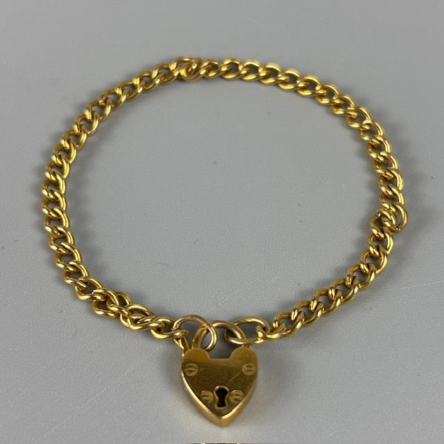 9CT GOLD CURB CHARM BRACELET.