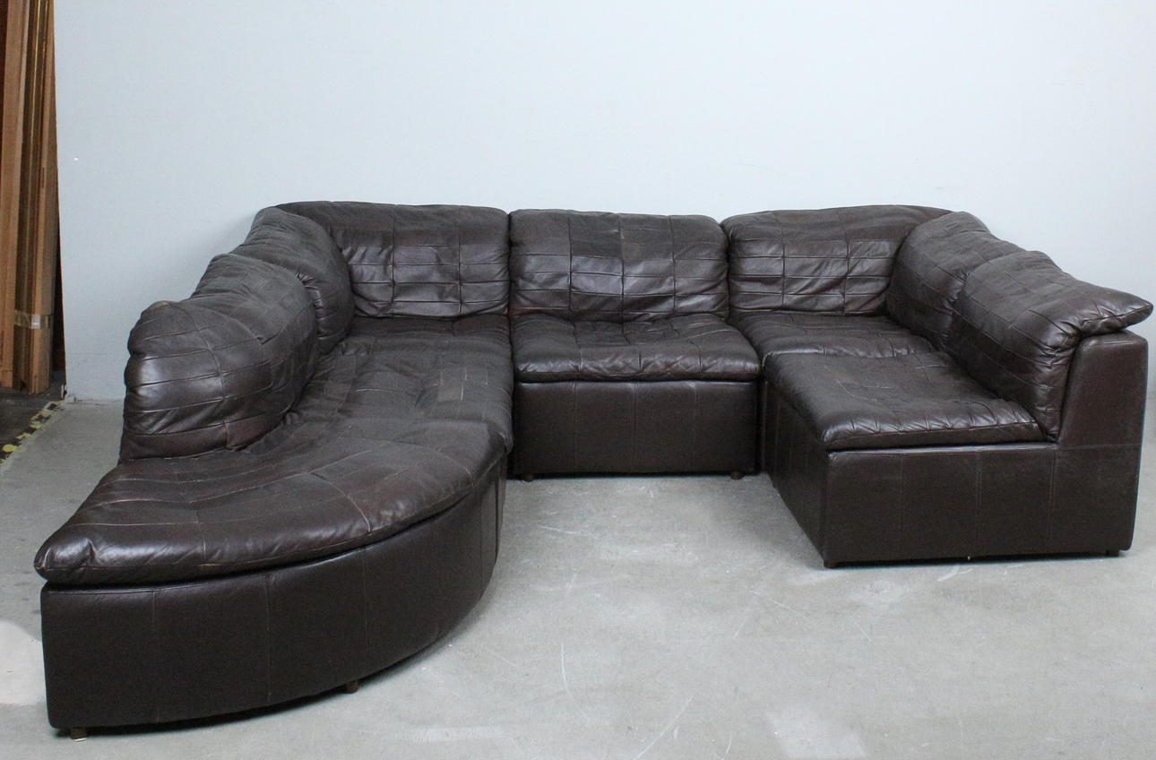 OLE CLEMMENSEN. Laauser International, six-piece modular sofa/seating area, patchwork leather, wood, 1970s, Germany (6).