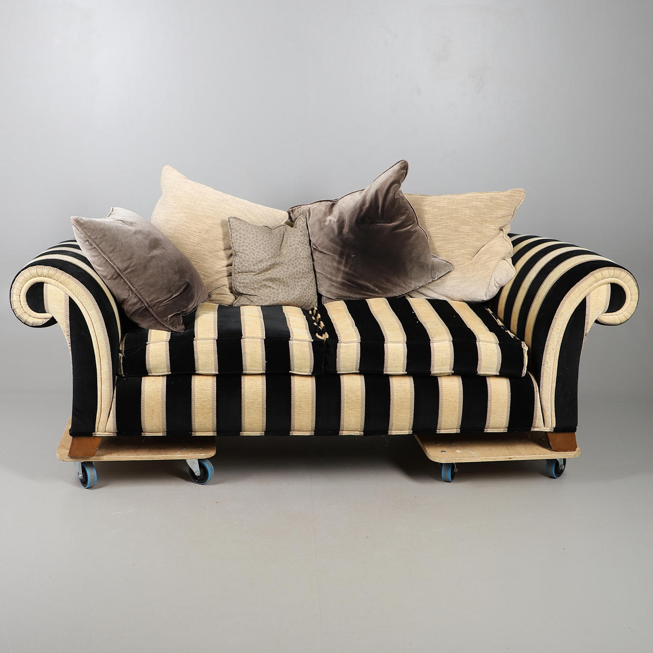 A LARGE STRIPED SOFA.
