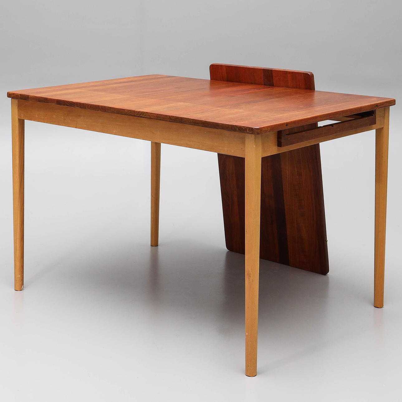NILS ROOTH. A teak & beech dining table, “Atle/292