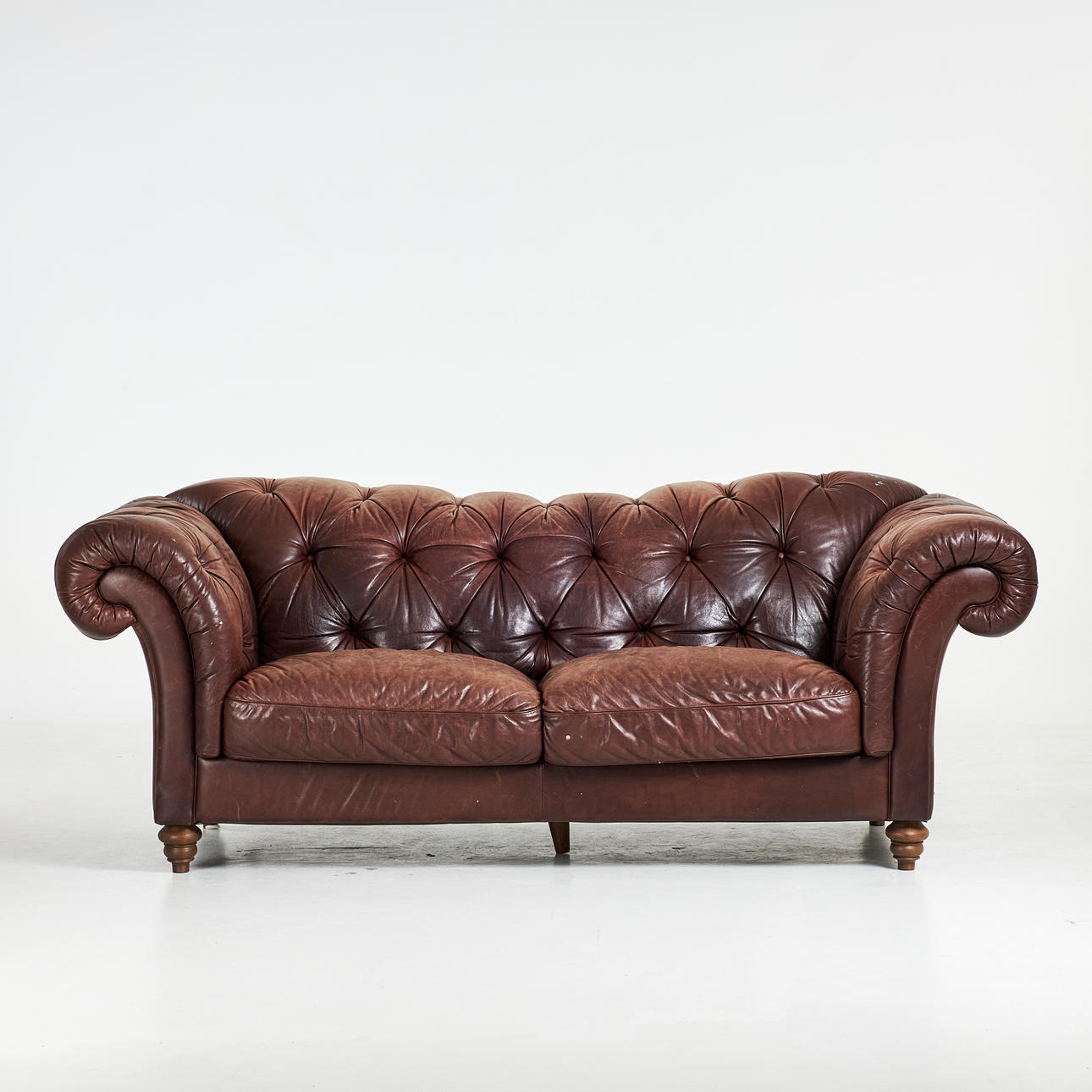 A leather sofa, deep-stapled, branded Natuzzi, Italy, 1900/2000s.