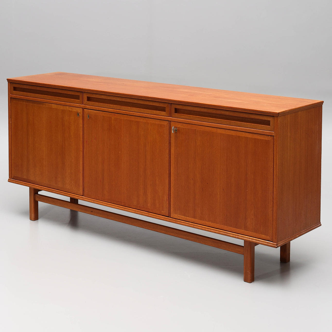 A 1950s/60s teak veneer sideboard.