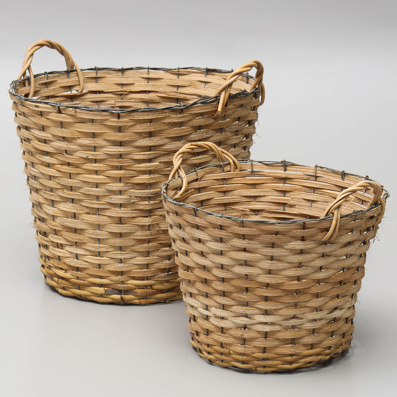 A set of two 20th century general-purpose baskets.