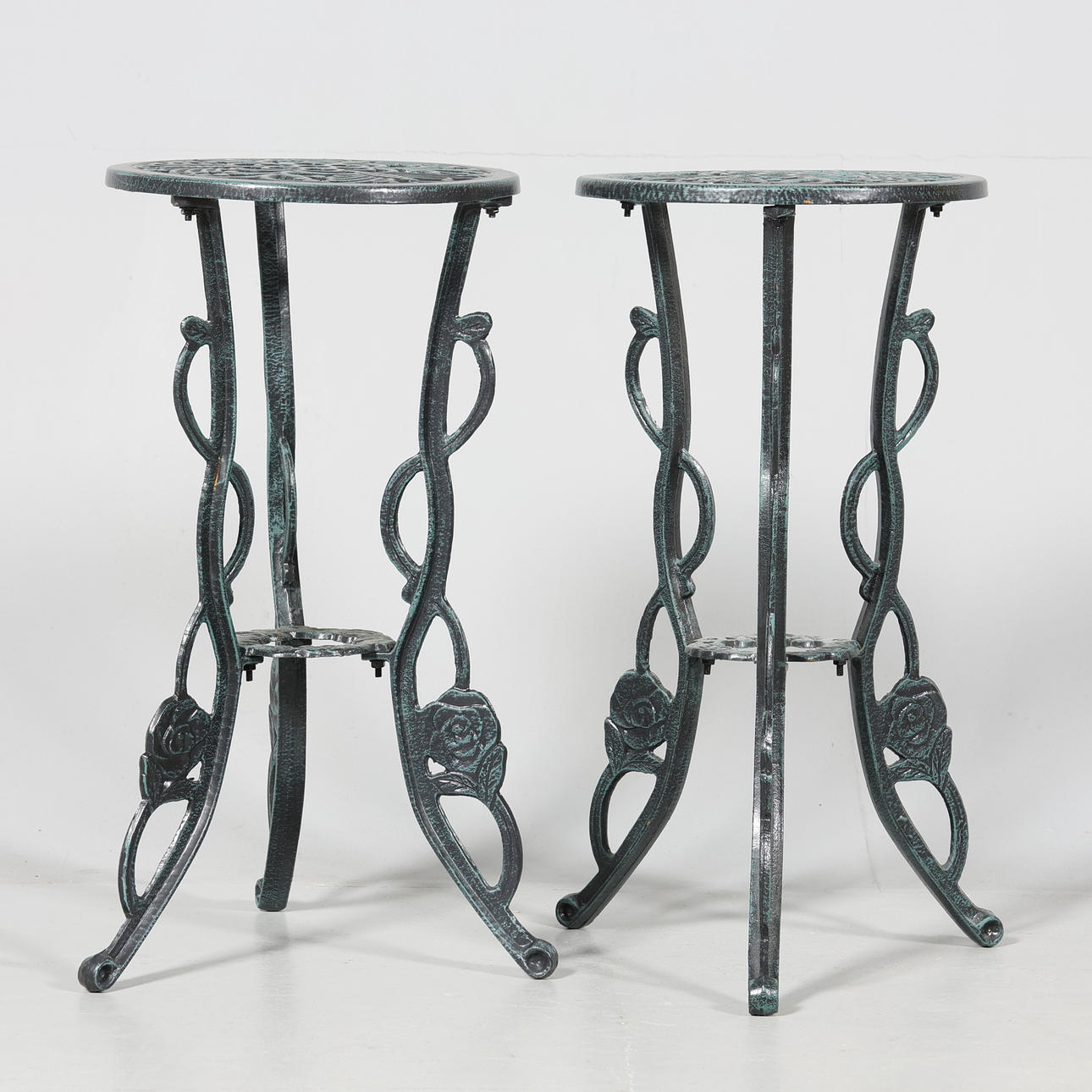 A pair of flower tables, metal.