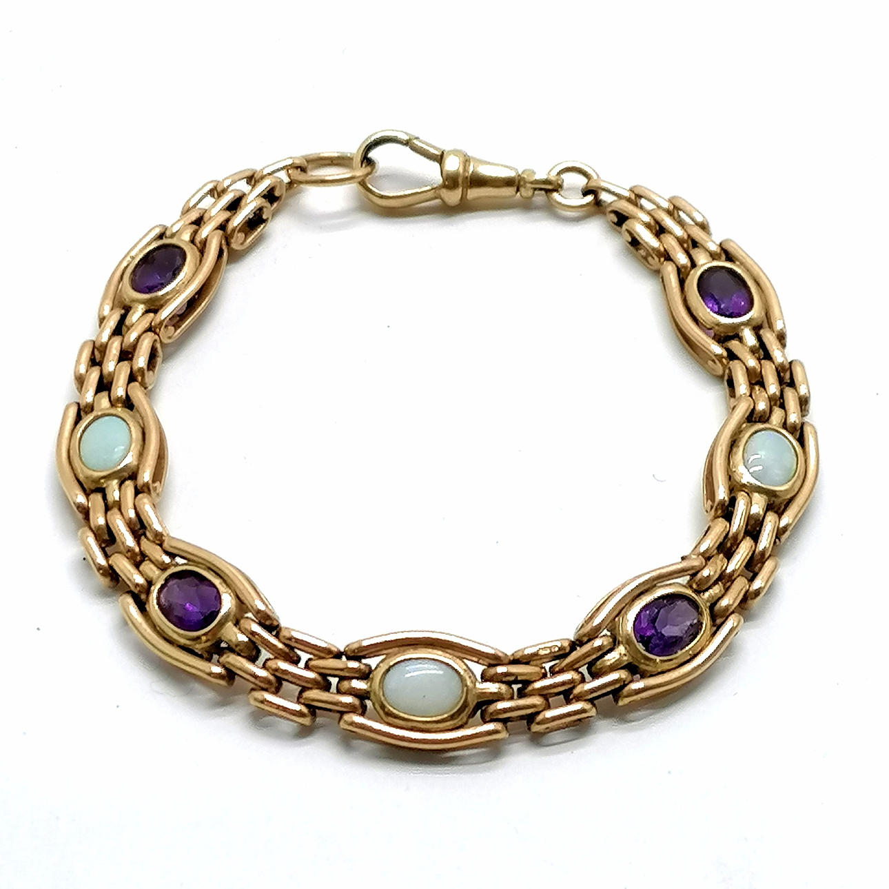9ct GOLD AMETHYST & OPAL SET BRACELET.