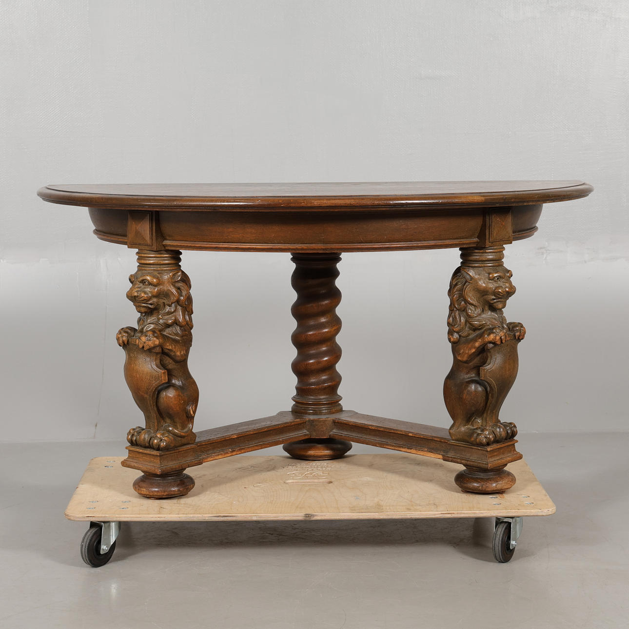 An oak half-moon table, 20th century.