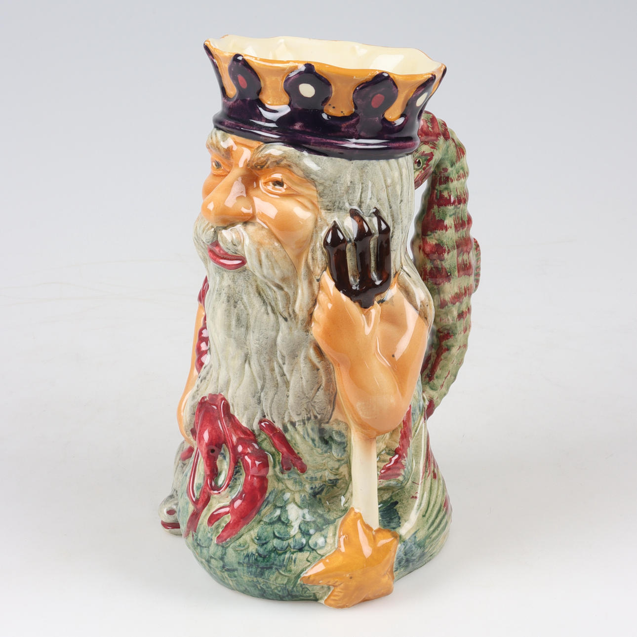 A “Father Neptune” flintware jug, Shorter, England.