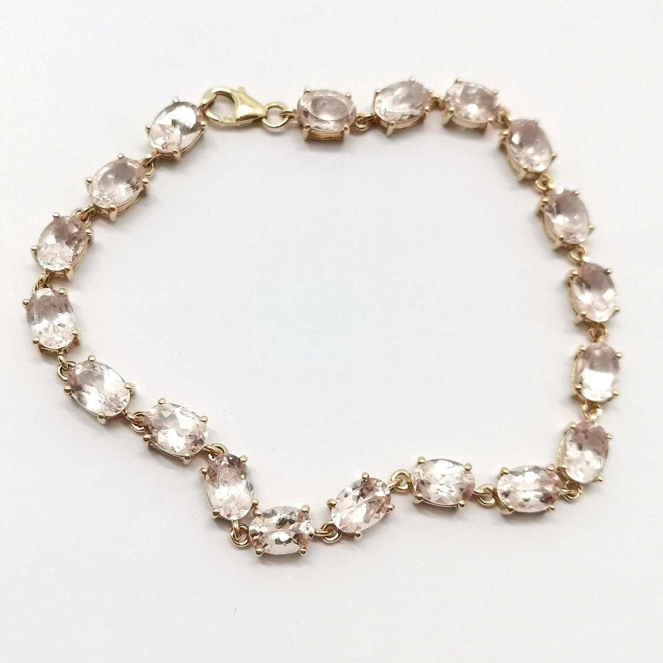 9ct GOLD MORGANITE STONE SET BRACELET.