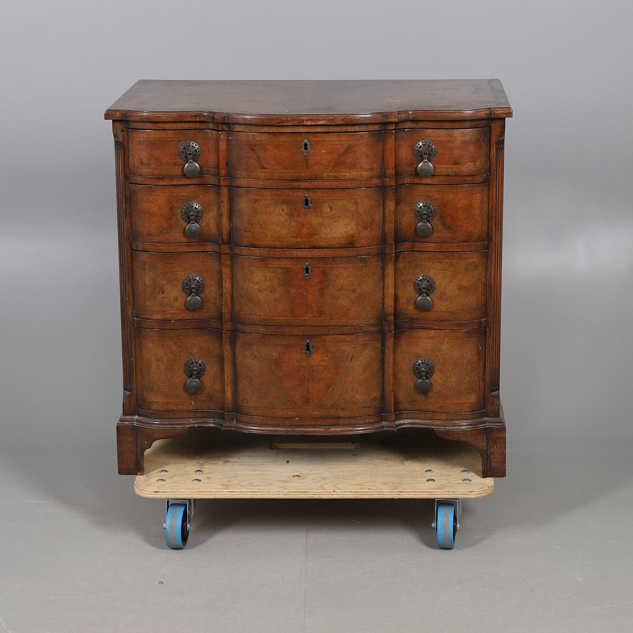 AN 18TH CENTURY STYLE WALNUT COMMODE.