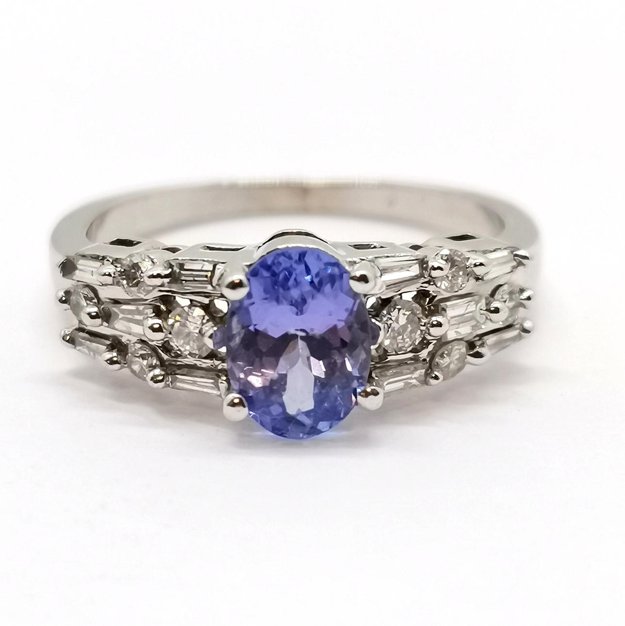 14ct WHITE GOLD TANZANITE RING WITH DIAMOND SET SHOULDERS.