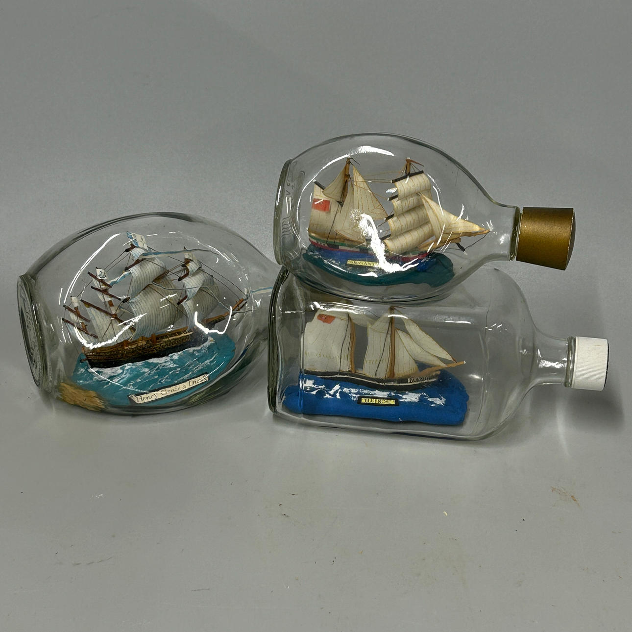 THREE SHIPS IN BOTTLES.