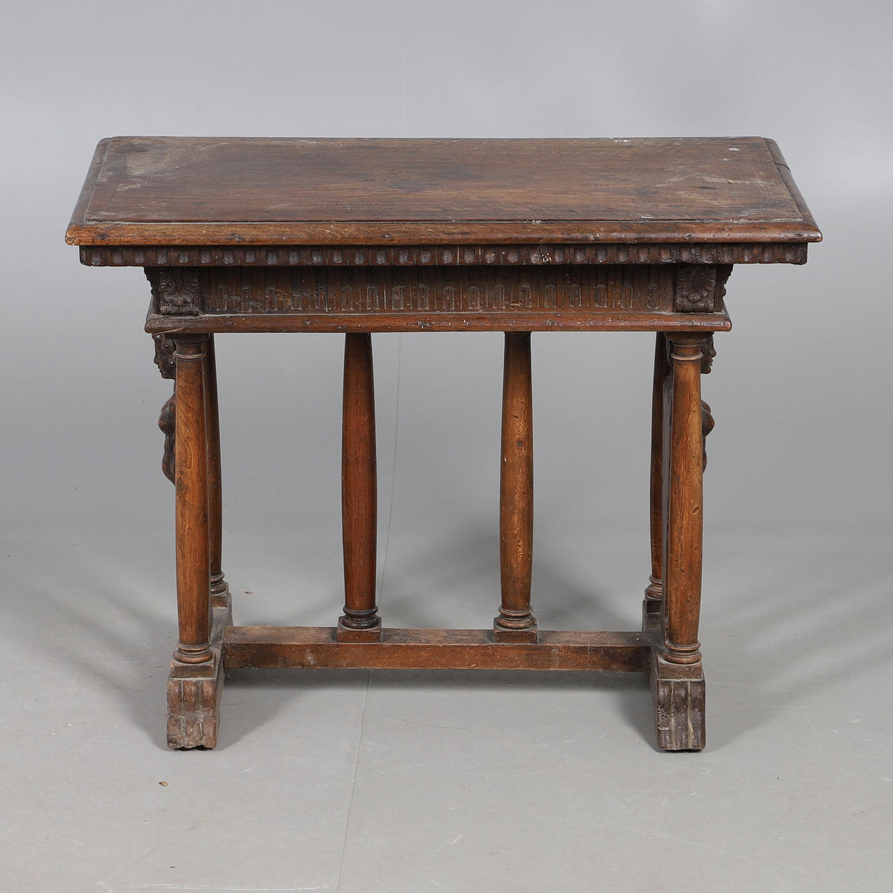 A RENAISSANCE STYLE ITALIAN WALNUT SIDE TABLE.