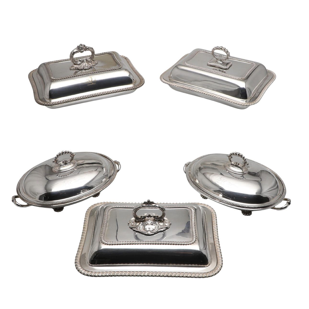 A SET OF FIVE SILVER PLATED LIDDED SERVING DISHES.