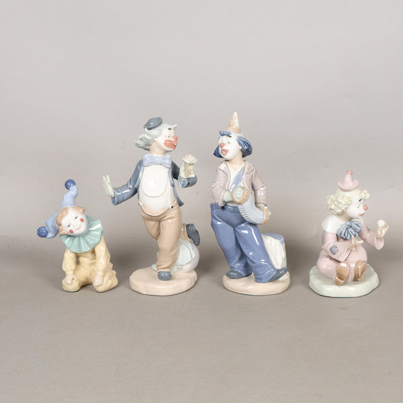 FOUR NAO FIGURINES (4).