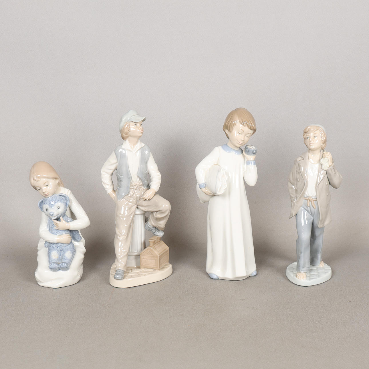 FOUR NAO PORCELAIN FIGURES (4).