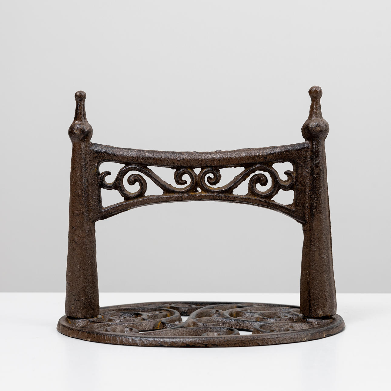 A cast iron foot scraper, 20th century.